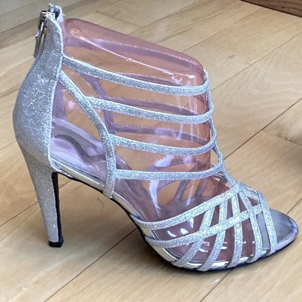Nina silver glittery, strappy high heels, zipper to back. Women’s size 7
